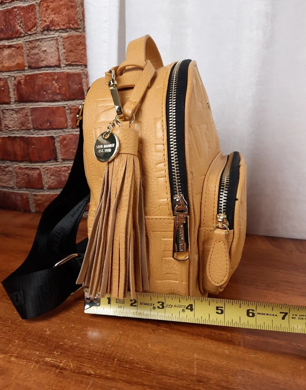 Steve Madden Mustard Mini Tassel Backpack